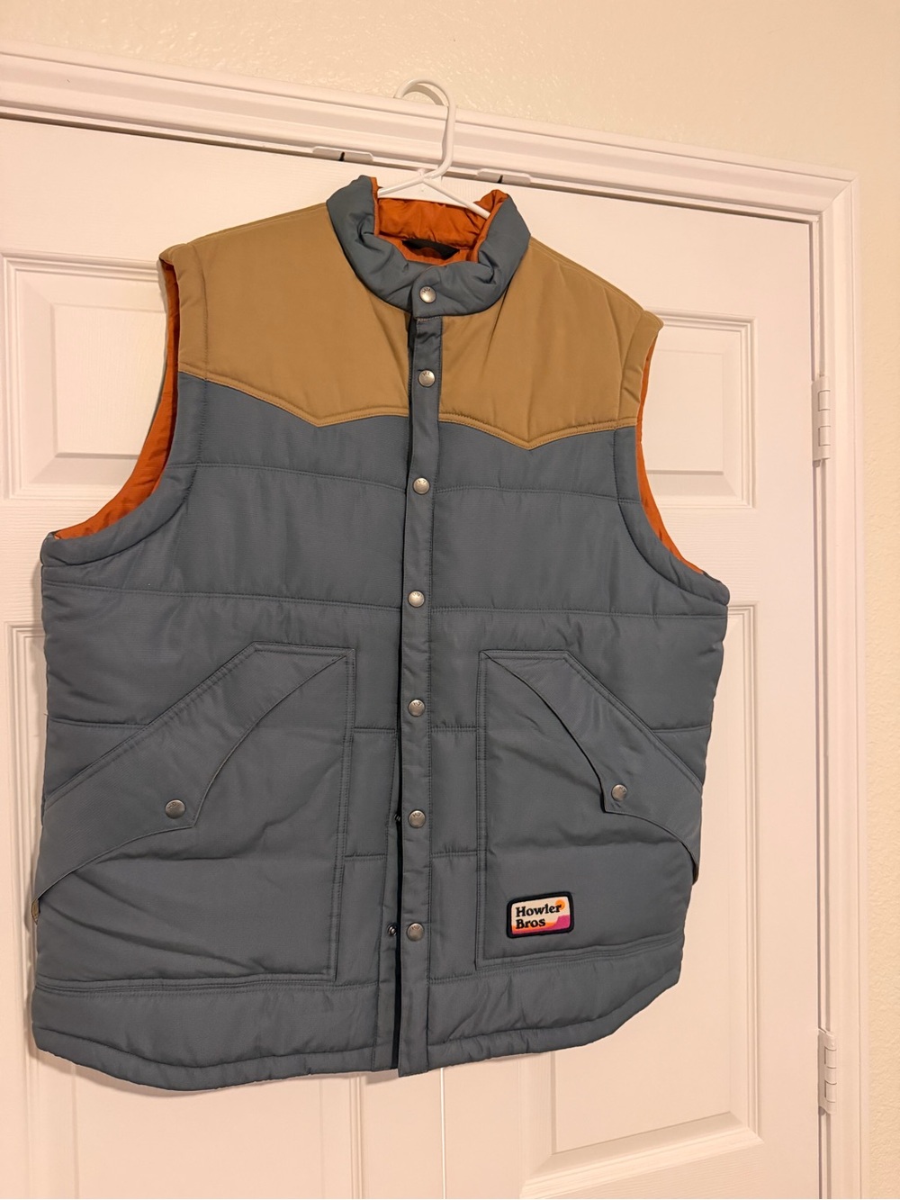 Howler Brothers Two-Tone Puffer Vest in Blue, Tan and Orange Lining